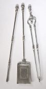 A set of George III steel fire irons, to include the shovel, poker and tongs with knopped finial,