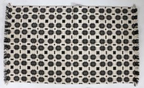 A Welsh blanket, geometric design in white and black, 90cm x 155cm approximately