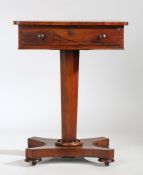 A Victorian rosewood writing table, the rectangular top above a frieze drawer fitted with small
