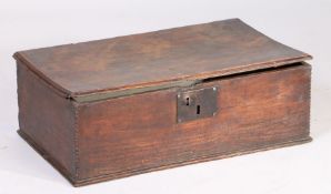 An 18th Century oak desk box, the rectangular top above a chip carved front panel and plain sides,