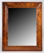 A William & Mary walnut cushion framed mirror, circa 1700, the moulded framed with later bevelled