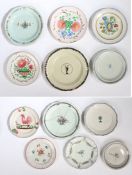 A collection of 19th Century French pottery plates, various designs to include flowers, baskets of