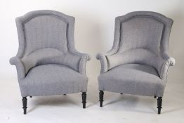 A pair of 19th Century armchairs, the arched backs above a bow seat flanked by low arms raised on