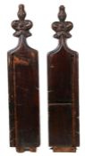 A pair of 19th Century pew ends, carved as poppy heads above rectangular side panels, 132cm high, (