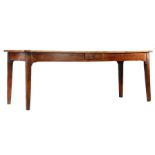 A 19th Century French chestnut and fruitwood farmhouse table, the plank top with cleated ends