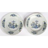 A pair of 18th Century English Delft plate, London circa 1760, with blue, yellow and green foliate