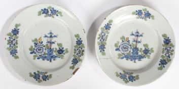 A pair of 18th Century English Delft plate, London circa 1760, with blue, yellow and green foliate