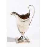 A George III silver cream jug, London 1790, maker Peter & Ann Bateman, of helmet form with loop