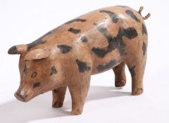 A carved wooden model of a Gloucester old spot type pig, 25cm wide