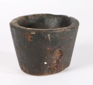 A primitive 19th Century carved wood mortar, 14.5cm wide, 11cm high