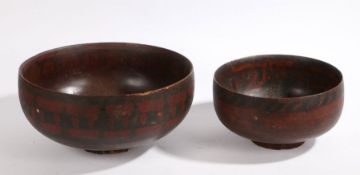 Two 19th Century painted Russian bowls, the larger with stylised foliate decoration, 27.5cm and 36cm
