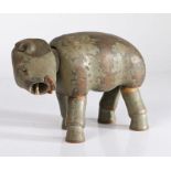 A late 19th/early 20th century grey painted wooden articulated elephant toy, with glass eyes and