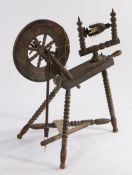 A Victorian spinning wheel, with bobbin turned wheel spokes and frame