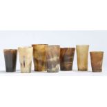 A collection of horn beakers to include an example inscribed "Wm. HOLMES MANOR FARM YORK" and with