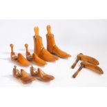 Four pairs of treen shoe and boot trees, the boot trees stamped 8, one of the pairs of shoe trees