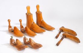 Four pairs of treen shoe and boot trees, the boot trees stamped 8, one of the pairs of shoe trees