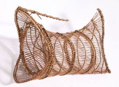 A wicker eel trap, with oval aperture to one end, 44cm wide