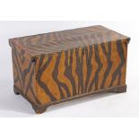 A naively painted pine chest, decorated with tiger stripes and having a candle box to the