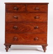 A varnished pine chest of two short and three long drawers, with turned handles, raised on turned