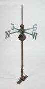 A weathervane, with the four points of the compass symbolised by capital letters, 109cm high, 59cm