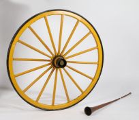 A 19th century yellow painted stage coach wheel, the metal rim with wooden supports, 110cm