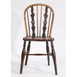 A late 18th century yew wood dining chair with Greek urn and turned spindle back, solid dished seat,
