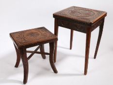 An early 20th Century carved oak occasional table, the top with central foliate roundel surrounded