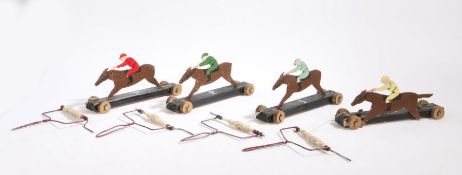 An early 20th Century horse racing game, consisting of four horse and jockey silhouettes mounted