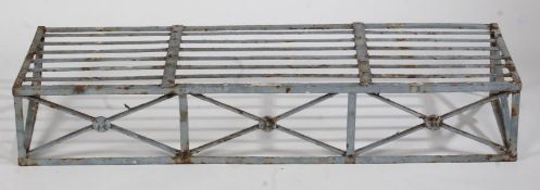 A 19th Century cast iron plant stand, the pierced slatted top raised on pierced cross form