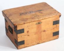 An early 20th Century pine and metal bound storage chest, the hinged lid named 'F.T. Bacon.' with