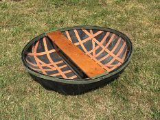 A coracle, of ribbed construction with plank seat, 128cm x 137cm