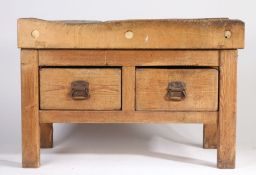 A Butchers block on stand, the worn block above a stand with two short drawers and rectangular