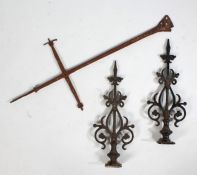 A pair of iron door hinges with cast scroll decoration, 58cm long together with a metal door hinge