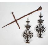 A pair of iron door hinges with cast scroll decoration, 58cm long together with a metal door hinge