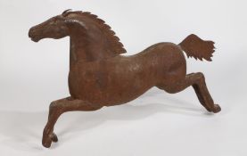 A very large 20th century folk art style metal horse, with rivetted body, modelled in a galloping