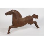 A very large 20th century folk art style metal horse, with rivetted body, modelled in a galloping