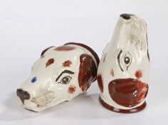 A pair of 19th Century porcelain stirrup cups, 1820/1830, in the form of hound's heads with brown