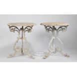 A pair of early 20th Century cast iron conservatory or garden tables, the pierced scroll decorated