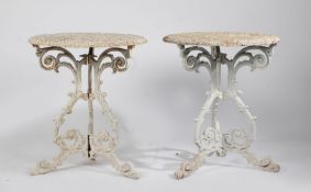 A pair of early 20th Century cast iron conservatory or garden tables, the pierced scroll decorated