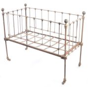 A late 19th/early 20th Century child's crib, with white painted metal frame, 123cm wide, 61cm