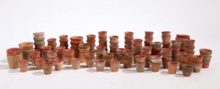 A collection of miniature terracotta plant pots, from 3cm high to 4cm high (qty)