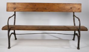 A 19th Century garden bench, possibly French, with naturalistic branch form ends, later back and