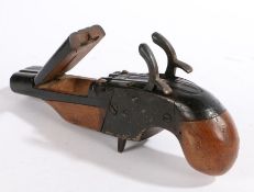 A 19th Century treen and metal snuff box, modelled as a double barrelled pistol, the barrels with