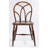 An early 19th century Thames Valley elm and oak Gothic Windsor chair, the hoop back with Gothic