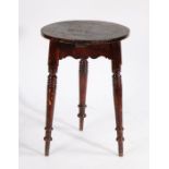 A Victorian occasional table, the circular top raised on turned legs, 51.5cm diameter