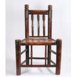 A 19th Century turners or bodgers style chair, with turned cresting rail, splats and supports, solid