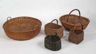 A collection of five woven baskets to include a large circular twin handled example, the largest