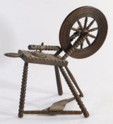 A Victorian spinning wheel, with turned wheel spokes and bobbin turned frame
