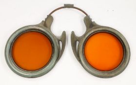 An unusual early 20th Century opticians trade sign, in the form of a pair of metal spectacles with