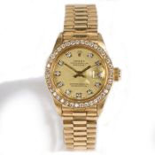 A lady's Rolex Datejust 18 carat gold and diamond wristwatch, the signed gilt dial with diamond